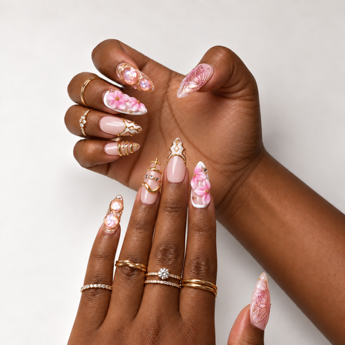 Blush Papillon press-on nails worn on hands