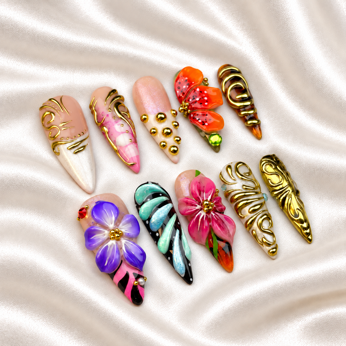 Gilded Botanica press-on nails - Vivid sculpted flowers and ornate gold-tone swirls - opposite angled view