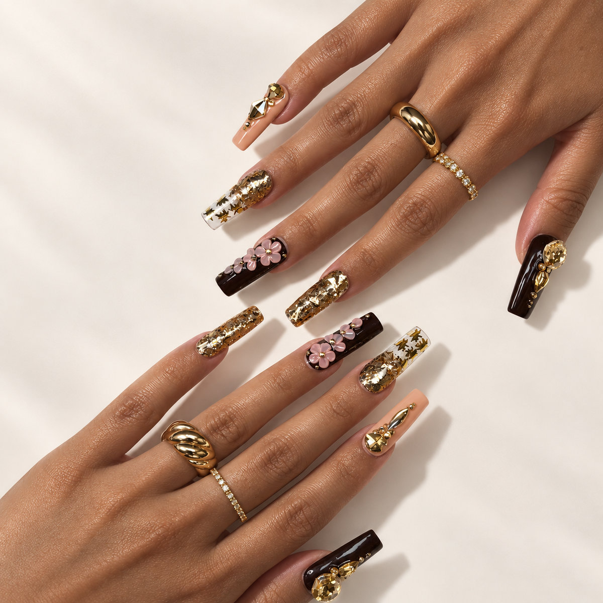 Gilded Petals press-on nails worn on hands