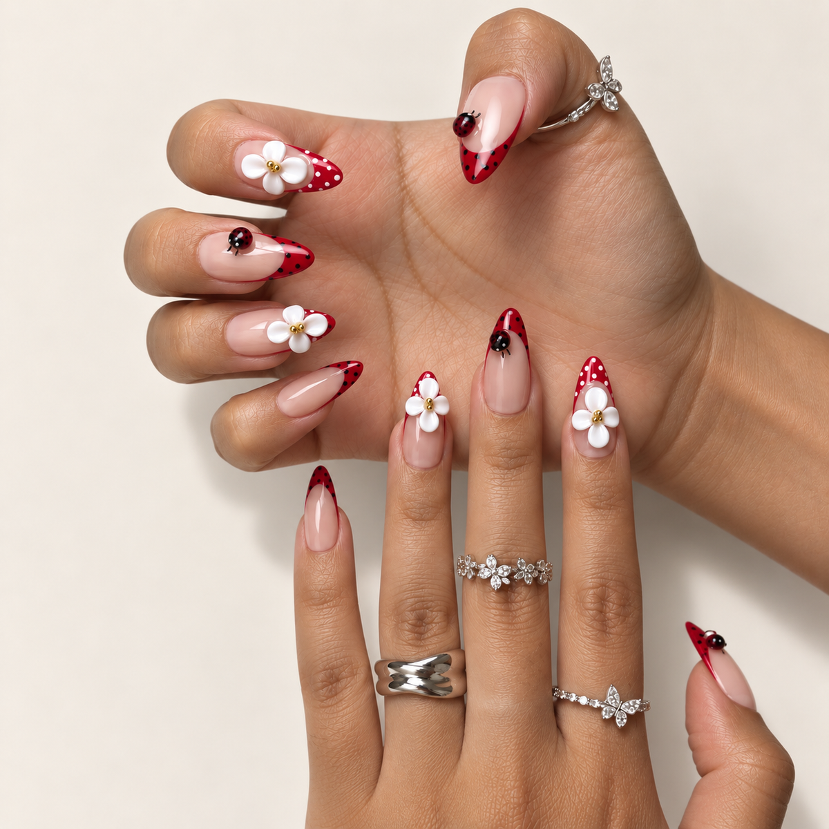 Scarlet Meadow Almond press-on nails worn on hands